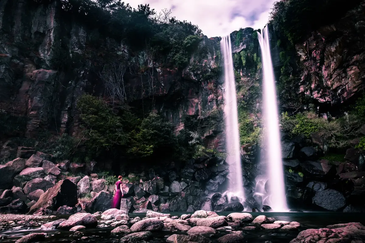 Jeongbang Falls dropping onto the shore
