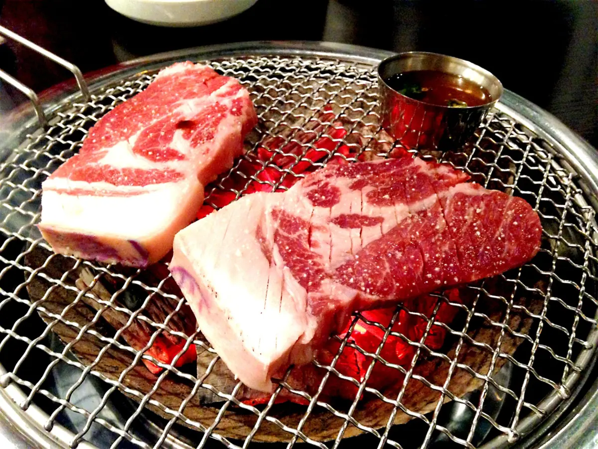 Pork on a charcoal grill
